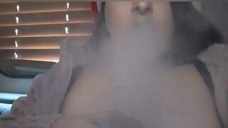 Stoner wears a Santa Hat + oils up Big Bouncy Boobs while smoking - 4 image
