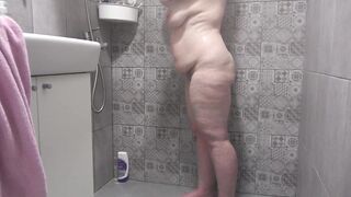 A hidden camera in the shower room spies on a mature wife with a plump figure and big tits and a fat booty Homemade fetish - 11 image