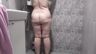 A hidden camera in the shower room spies on a mature wife with a plump figure and big tits and a fat booty Homemade fetish - 2 image