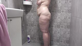 A hidden camera in the shower room spies on a mature wife with a plump figure and big tits and a fat booty Homemade fetish - 7 image