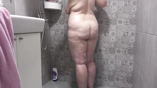 A hidden camera in the shower room spies on a mature wife with a plump figure and big tits and a fat booty Homemade fetish