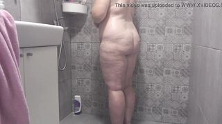 A hidden camera in the shower room spies on a mature wife with a plump figure and big tits and a fat booty Homemade fetish - 9 image