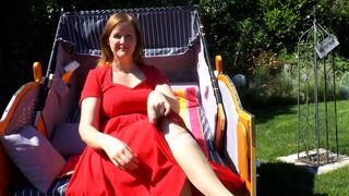 Milf gives footjob in a beach chair - 1 image