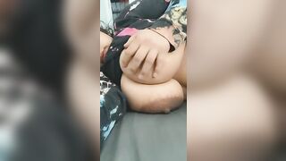 Lydia playing with her huge nipples.