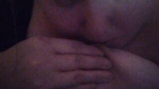 Girl licks and sucks her own nipple