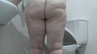 Hidden camera in the toilet spying on a mature wife. Chubby milf with hairy pussy pisses a lot. home fetish. - 11 image