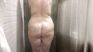 Hidden camera in the shower spies on a chubby milf with big boobs and a juicy PAWG. Homemade fetish for a mature husband. - 13 image