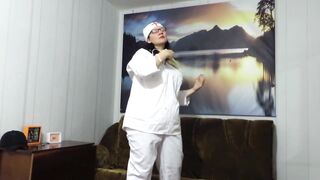 Striptease mature nurse in a restroom. Chubby MILF takes off her medical uniform and shows her gorgeous booty, big boobs and long legs in stockings and high heels. Amateur foot fetish. - 2 image