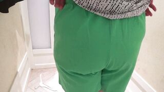 Hidden camera in the fitting room spying on a mature PAWG. Chubby milf with big booty in panties tries on different shorts. Amateur fetish and close-ups. - 14 image