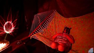 Getting frisky in a tent fingering her wet hole in a hammock - 2 image