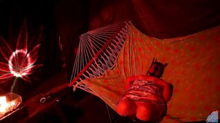 Getting frisky in a tent fingering her wet hole in a hammock