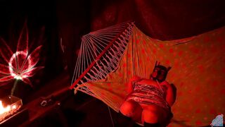 Getting frisky in a tent fingering her wet hole in a hammock