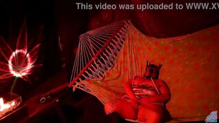 Getting frisky in a tent fingering her wet hole in a hammock