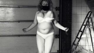 Jumping over a rope. Mature BBW MILF shaking big tits. - 2 image