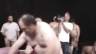 Blond with big boobs sucks cocks of very fat males then gets covered in jizz - 5 image