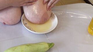 Fat MILF wanted to cook dinner but stuck a big zucchini in her hairy pussy. Fat ass and big boobs in oil. PAWG. Home fetish masturbation. Amateur. - 2 image