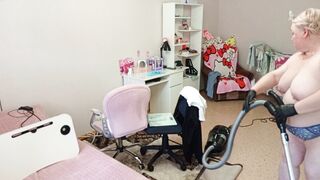Mother-in-law vacuums the room naked