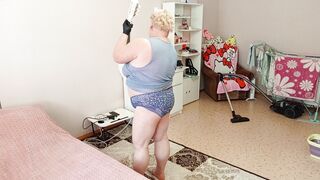 Mother-in-law vacuums the room naked