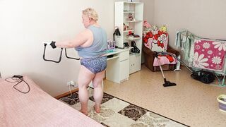 Mother-in-law vacuums the room naked