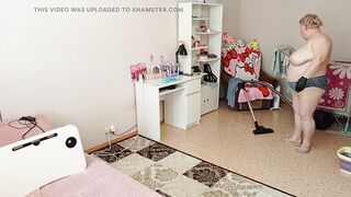 Mother-in-law vacuums the room naked
