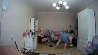 mother-in-law cleans the room naked