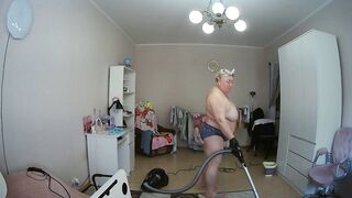 mother-in-law cleans the room naked