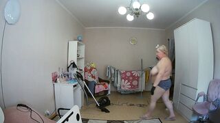 mother-in-law cleans the room naked
