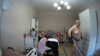 mother-in-law cleans the room naked