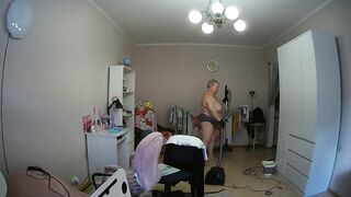 mother-in-law cleans the room naked