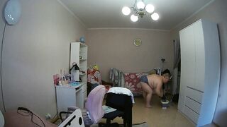 mother-in-law cleans the room naked