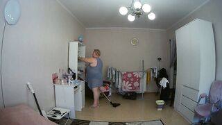 mother-in-law cleans the room naked