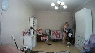 mother-in-law cleans the room naked