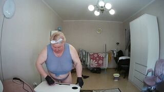 mother-in-law cleans the room naked