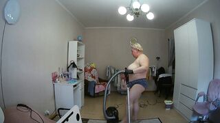 mother-in-law cleans the room naked