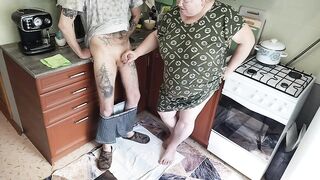 a fat woman jerks off my dick in the kitchen and I cum powerfully