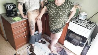 a fat woman jerks off my dick in the kitchen and I cum powerfully