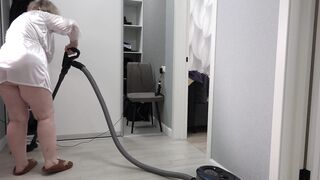 A home camera watches a mature housewife with a thick butt under a short robe and big tits. Chubby MILF behind the scenes. PAWG. - 15 image