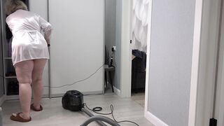 A home camera watches a mature housewife with a thick butt under a short robe and big tits. Chubby MILF behind the scenes. PAWG. - 5 image