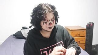 Clown girl Blowing up and popping huge balloon