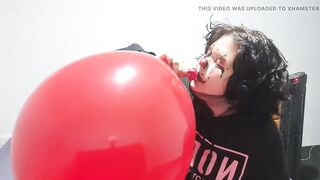Clown girl Blowing up and popping huge balloon
