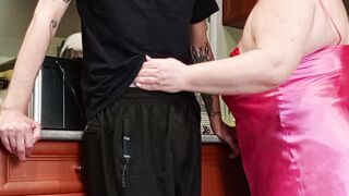 in the kitchen, the stepmom sucks off a dick, jerks it off and watches the sperm