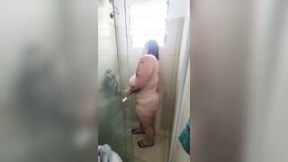 Chubby babe with perfect tits takes a hot shower after gym session